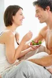 Illustration for a blog post about how we choose a life partner – a joyful woman and man gazing at each other.